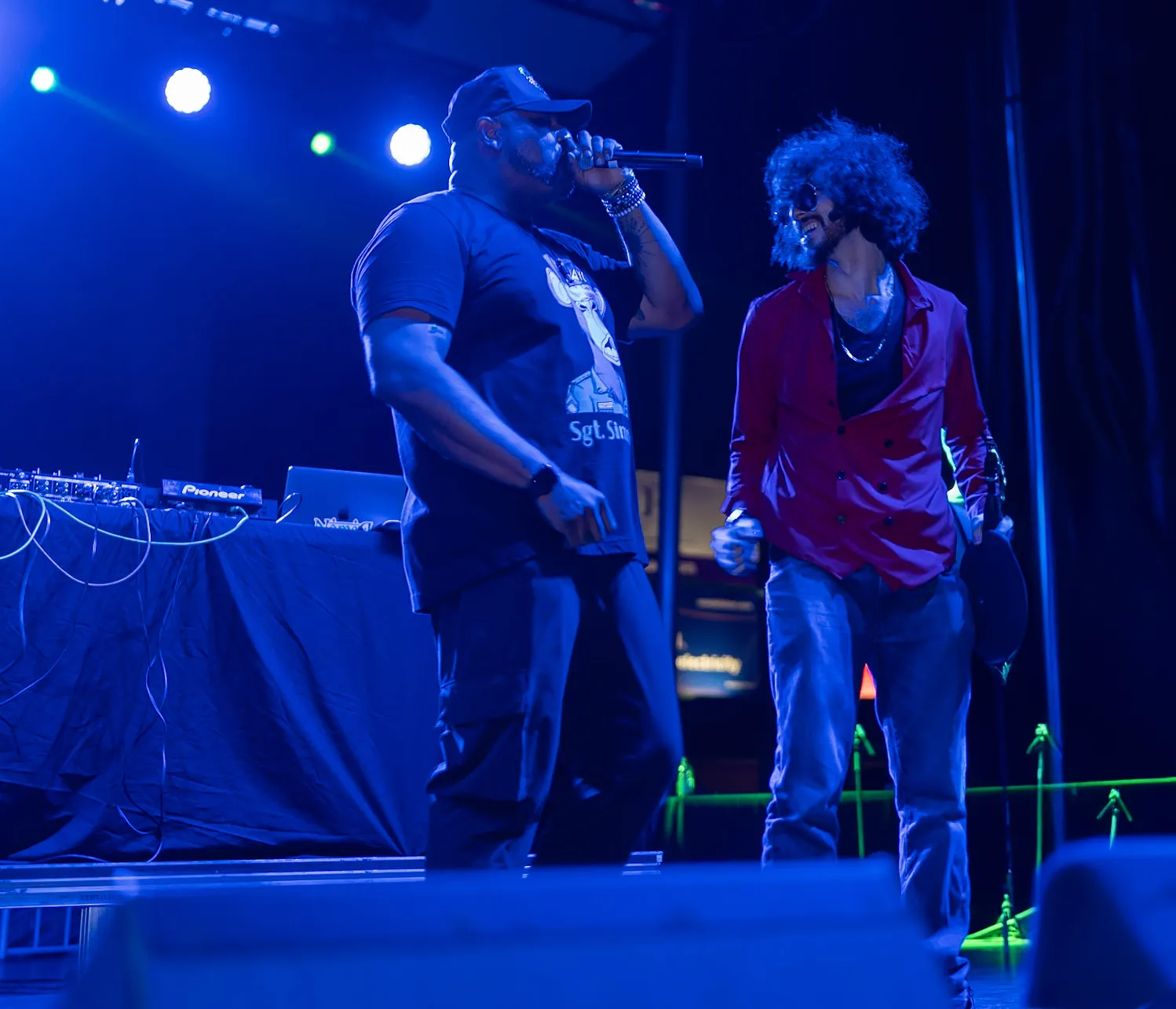 Rito standing with Damon Elliott on stage at Dogepalooza