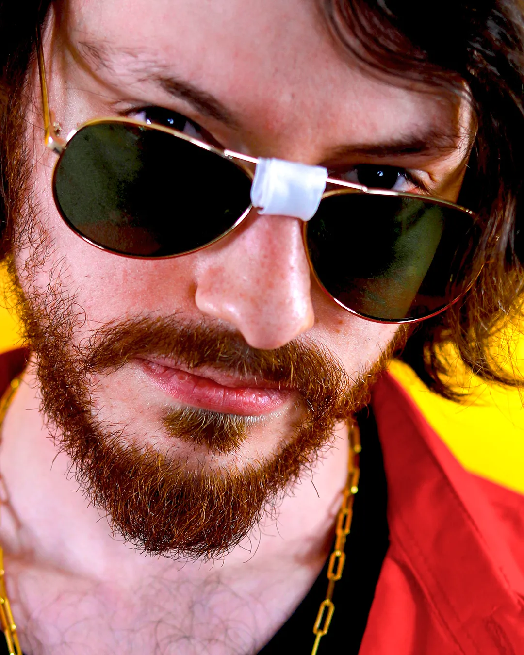 Close up portrait of Rito Rhymes wearing sunglasses