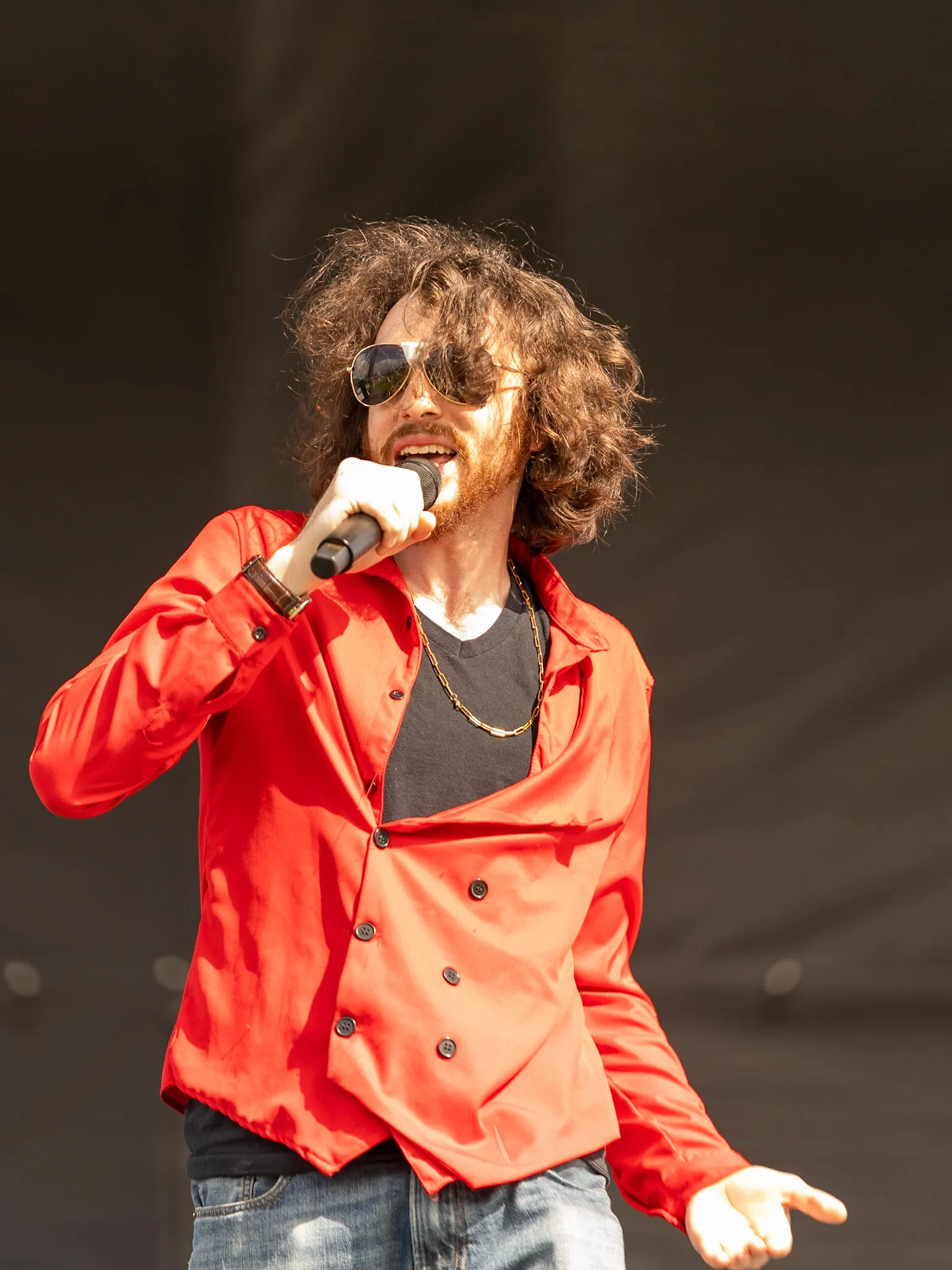 Rito Rhymes performing with a microphone